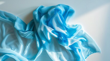 Poster - top view with blue kitchen napkin isolated on table background Folded cloth for mockup with copy space Flat lay Minimal style : Generative AI
