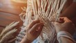Creative hobby handmade macrame for home decoration Close up of womens hands weaves macrame Flat lay top view : Generative AI