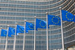 © respiro888 - Fluttering European Union flags in a row in Brussels, Belgium. Close up