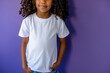 © Larisa - Smiling child with curly hair wearing a plain white t-shirt on a purple background. Mockup t-shirt.