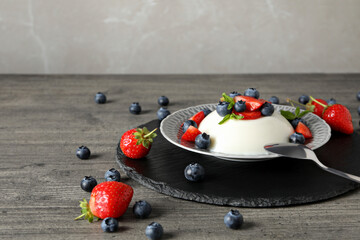 Wall Mural - Dessert panna cotta, on the table, on a gray background.