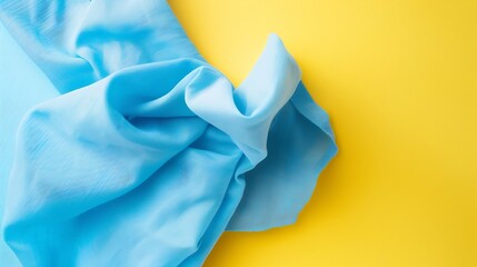 Poster - top view with blue kitchen napkin isolated on table background Folded cloth for mockup with copy space Flat lay Minimal style : Generative AI
