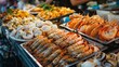A seafood market display showcasing an assortment of fresh catches, including shrimp, squid, and fish, ready to be grilled or fried Thai-style.