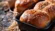 Close up shot homemade food baking concept Fresh hot soft fluffy ginger golden brown sesame seeds buns pie bread dessert pastry in loaf pan Bakery products image with copy space : Generative AI