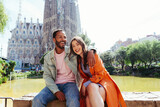 Fototapeta Londyn - Multiracial beautiful happy couple of lovers dating in Barcelona
