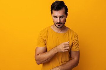 Wall Mural - Fashion man gesture studio confident trendy background smiling yellow lifestyle space portrait copy arm laughing style