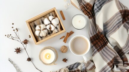 Wall Mural - Autumn flat lay composition Brown plaid and wooden box with candle decorations cotton cinnamon sticks coffee cup on white background Hygge cozy home comfort concept : Generative AI