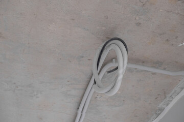 Poster - Apartment renovation. Electrical wiring. Wiring electrical cables on wall in the apartment Building under construction, work in progress. Placement of electrical wires and cables.