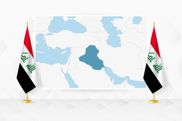 Wall Mural - Map of Iraq and flags of Iraq on flag stand.