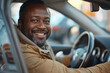 Happy African American Man Smiling in His Car