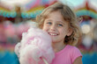 Young Girl Enjoying Cotton Candy at a Colorful Carnival