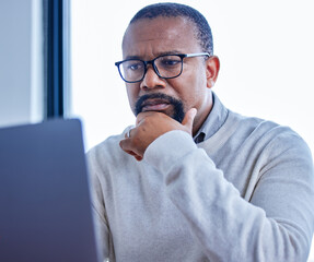 Poster - Thinking, business and mature black man on laptop working on project or research on internet in office. Technology, idea and African manager reading news or company report for financial info or email