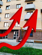 Two red growing up large 3d arrow on residential building background. Rising prices for purchase, sale and rental of real estate. Inexpensive apartments. Cityscape. Modern house. Bar chart and graph