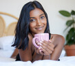 Breakfast, bed and Indian woman with coffee, portrait and smile in morning, relax and happiness in hotel. Vacation, break and holiday for girl, drink and beverage of espresso, resort and bedroom