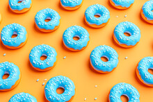 3d Blue Cartoon Blue Donuts On An Orange Background