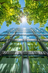 Wall Mural - Sustainable glass office building with tree in eco urban setting reducing carbon dioxide emissions