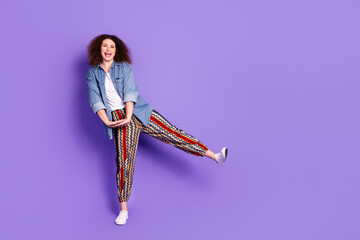 Wall Mural - Full size photo of cool nice girl enjoy dancing empty space wear denim shirt isolated on violet color background