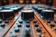 Close-up of a modern professional audio mixing board's detailed knobs and dials in a recording studio environment