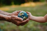 Fototapeta  - Senior hands giving small Earth to child: Passing on the legacy of stewardship AI Image