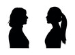 Middle aged woman and young woman facing each others side profile silhouette.