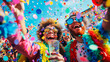 © Alina Tymofieieva - A group of people are having fun at a carnival in colorful festive costumes wearing confetti. Friends relaxing at a costume party outdoors. Holiday concept.