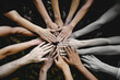 © john - an image of hands reaching in together in a cirlce, teamwork