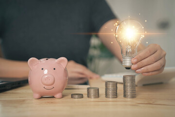 Poster - How to reduce electricity bills and increase savings. Saving money by saving electricity. Ideas for saving money and investing. Businessman holds a light bulb on money. Ideas for saving energy.