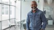 © Marta B - Smiling Man in Modern Office