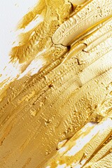 Poster - Close up of gold paint on white surface. Suitable for backgrounds and textures