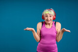 Fototapeta Młodzieżowe - Surprised Senior Woman with Wireless Headphones