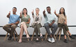 © peopleimages.com - Creative people, portrait and thumbs up with row, line or waiting room for good job or teamwork at office. Group of employees with smile, like emoji or yes sign for success, interview or startup