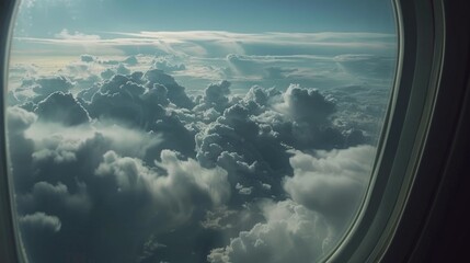 Poster - A view of clouds through an airplane window. Suitable for travel and transportation concepts