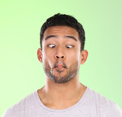 Sticker - Man, play and silly in studio, face and goofy comic or funny expression on green background. Male person, mockup space and guy for joke or comedy, student and humor for crazy character and quirky