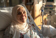  Happy woman in the hospital bed with cancer treatment