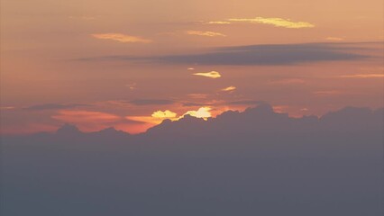 Wall Mural - Sunset is a beautiful view of the horizon, when the sunlight gives way to a colorful dusk with red clouds, time lapse.