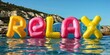 At the pool, inflatable letters that say relax float in the water.