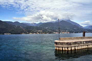 Wall Mural - concrete pier and mountains on Lake Garda