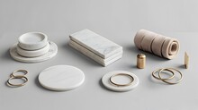 Elegant Kitchen Accessories A Collection Of Marble Coasters And Brass Napkin Rings On A Light Gray Background Generative Ai