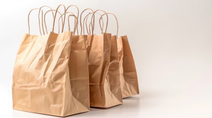 Aufkleber - A group of brown paper bags sitting next to each other. Perfect for eco-friendly and shopping concepts