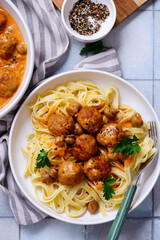 Canvas Print - Chicken meatballs beef stroganoff with pasta.top veiw