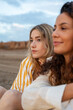 © Milles Studio/Stocksy - Calm girls admiring sunset at beach