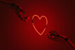 © Marcos Osorio/Stocksy - Robot hands holding a Neon heart
