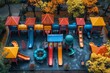 A top-down view of a bright and cheerful playground featuring various slides, swings, and climbing structures, with autumn colors