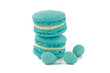 blue macaroon cookies and mini Easter eggs on a white background