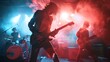 © stocker - Guitarist and drummer performing live on stage during a rock concert with red and blue stage lights.