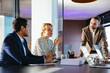 © BONNINSTUDIO/Stocksy - Group of financial advisors discussing strategy in office
