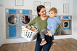 © Santi Nuñez/Stocksy - Mother and little boy doing laundry