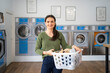 © Santi Nuñez/Stocksy - Portrait of Woman doing laundry