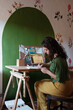 © Malquerida Studio/Stocksy - woman writing notes at her desk