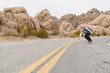 © Christine La/Stocksy - Skateboarder in Joshua Tree National Park